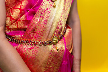 South Indian Tamil bride's wearing her wedding outfit and jewellery close up
