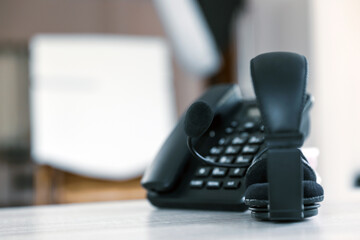 Customer service concept. Close-up headphone and telephone for communication helpdesk IT support or...