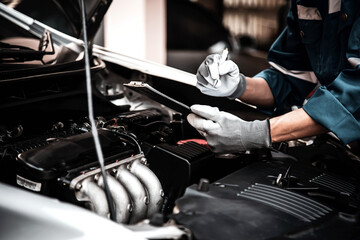 Car care maintenance and servicing, Close-up hand technician auto mechanic checking inspection list...