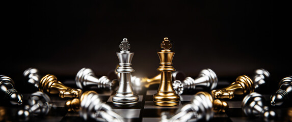 Close-up king chess standing on falling chess concepts of wining to challenge or battle fighting of...