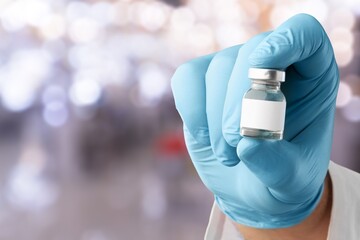 Doctor holding medical vaccine vial