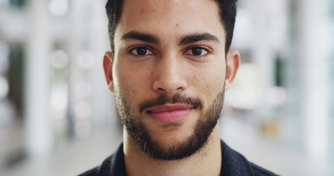 Plan and be a man of action. 4k video footage of a young handsome businessman in a modern office.