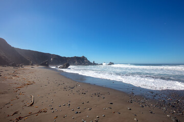 Fototapeta na wymiar Pebble strewn beach at Big Sur on the Central Coast of California United States