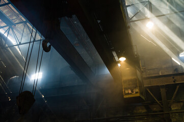 Large industrial crane operating in a foundry