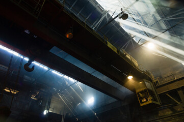 Large industrial crane operating in a foundry