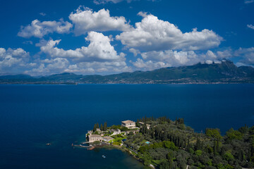 Fototapeta na wymiar Top view of baia delle sirene on the coastline of Lake Garda. Aerial view of Parco Baia delle Sirene, Lake Garda, Italy. Panorama of punta san vigilio.