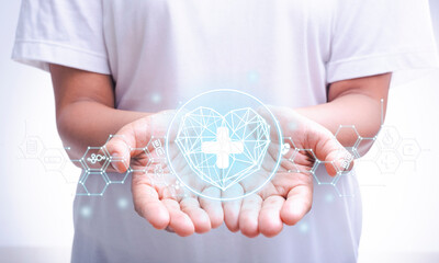 Doctor using virtual  health care heart symbol and icons medical technology on interface with medical network connection, medicine technology network concept, life insurance business.