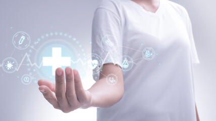 Obraz premium Woman holding network connection medical symbol and icons innovation technology medical on interface with medical network connection, medicine technology network concept, life insurance business.