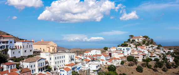 Kea island, Greece. Ioulis town panorama aerial view. Tzia Chora cityscape, blue cloudy sky