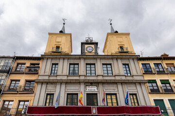 Fototapeta premium views of the historic buildings in the streets of Segovia with tourists walking under its streets in Segovia