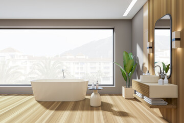 Light bathroom interior with tub, deck with decoration and window