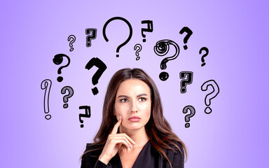 Businesswoman portrait with confused look, set of question marks