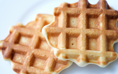 Homemade Belgian sugar waffles on plate closeup