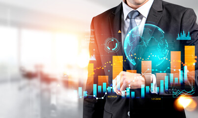 Businessman with smart watch, earth sphere and stock market chart