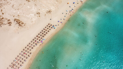 Aerial View From Flying Drone Of People Crowd Relaxing On Beach In Portugal
