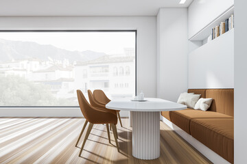 Stylish dining room interior with sofa and chairs, panoramic window