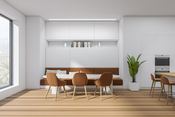 Stylish kitchen interior with dining area and bar countertop, window