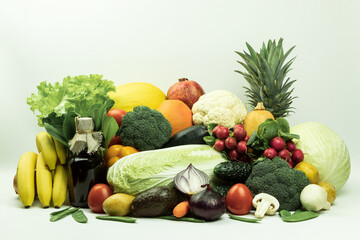 Fresh vegetables and fruits on a white background