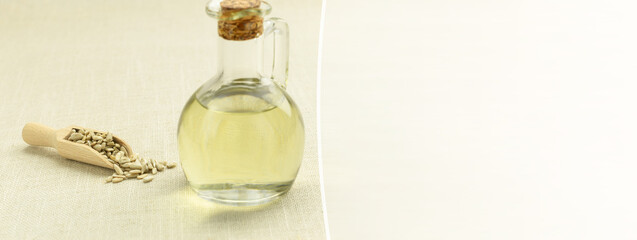 Sunflower, bottle of oil and seeds on the table