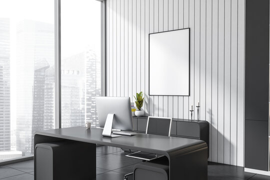 Close up view on dark office interior with white poster
