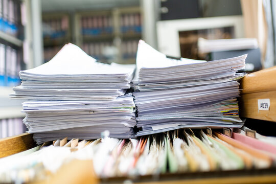 documents achieves paper files for searching information on work desk home office