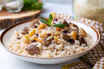 Traditional delicious Turkish food; rice pilaf with pine nuts and currants (Turkish name; bademli ic pilav or pilaf)