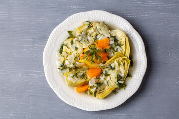 A dish with olive oil from Turkish Aegean cuisine; artichoke dish with rice and olive oil (Turkish name; zeytinyagli enginar)