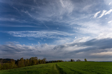 Obraz premium Blue sky and beautiful cloud with meadow and landscape. Simple landscape background for summer posters. Relaxing feeling like in heaven.