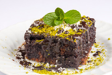 Chocolate moist cake. Wet cake in a plate. Bakery products. (Turkish name; islak kek)