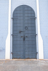 wooden church doors with ornate metal hardware