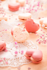 Happy Mothers Day - sweet macarons in heart shape with flowers in pink tone