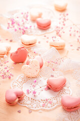 Happy Mothers Day - sweet macarons in heart shape with flowers in pink tone
