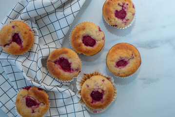 sweet vanilla raspberry muffins on a table