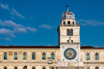 Fototapeta na wymiar Scenic view on the astronomical clock on Piazza dei Signori in Padua, Veneto, Italy, Europe. Column of the winged lion statue of Saint Mark background Astronomical Clock. Central square in Padova