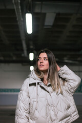 Young beautiful woman at dark background.