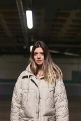 Young beautiful woman at dark background.