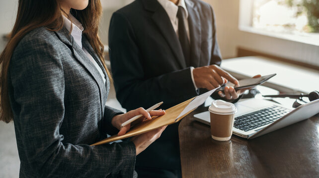 Businessman And Male Lawyer Or Judge Consult Having Team Meeting With Client, Law And Legal Services Concept In Office.