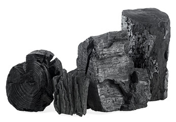 Heap of natural charcoal isolated on a white background. Traditional charcoal.