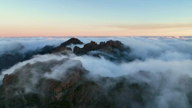 Top view of the third mountain on Madeira isalnd. Drone flight of the moutains in the morning light. Foggy morning on Madeira. Madeira, Portugal