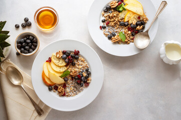 Healthy breakfast oatmeal porridge wit blueberries, cranberries, wallnuts and chia seeds. Dieting breakfast food