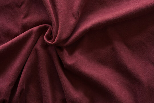 closeup texture of red wine color cotton fabric