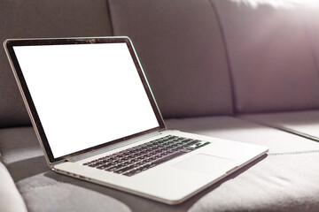 Mockup blank screen laptop in living room. Copy space.