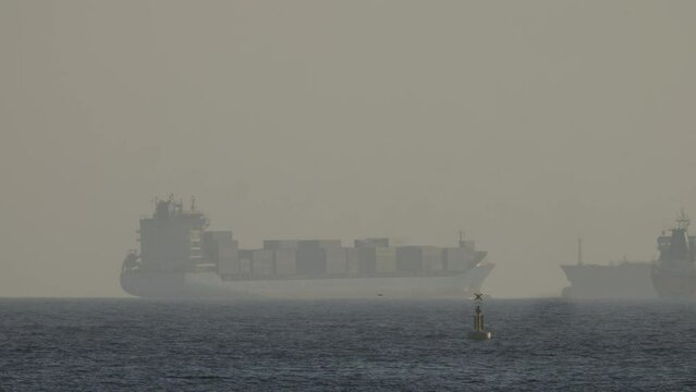 Container ships on the horizon in barcelona