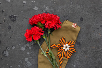 9 may holiday, Victory Day background. st. George ribbon, old military cap and spring flowers. symbol of 9 may, memory of war 1945