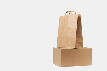Cardboard box and paper bag on isolated on white