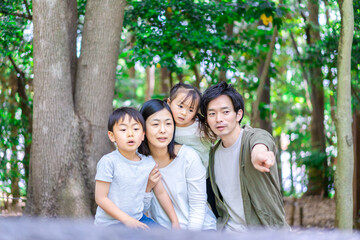 Family observing nature in the forest