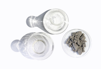 Aluminium powder in Chemical Watch Glass place next to Erlenmeyer flask and Flat Bottom Flask on...
