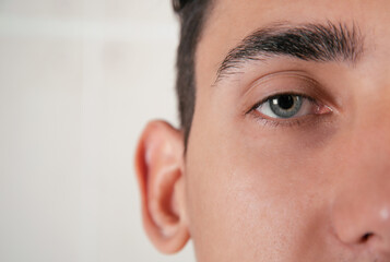Male eye close-up at the doctor's office. Checking visual acuity in the office of an...