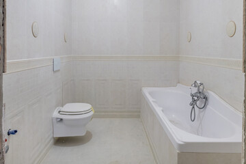 metal water tap with sink and faucet to turn on and regulate cold or hot water in expensive bathroom.