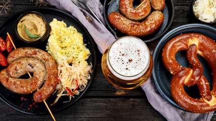 Grilled German sausages on wooden background.